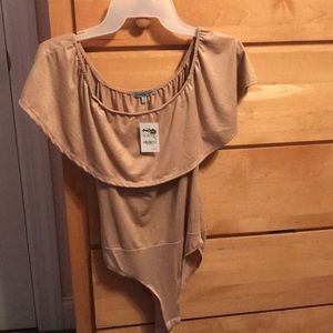 Tan body suit off the shoulders